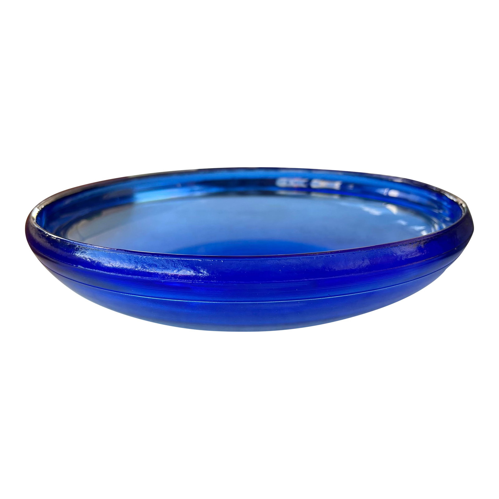 Vintage Large Cobalt Blue Glass Bowl for Serving or Decoration: Large Mid Century Cobalt / Royal Blue Glass Bowl. Wide rim curved inward measuring 11.75" in diameter. The glass bowl stands 2.5" tall. Condition: Alterations: Original Condition Unaltered