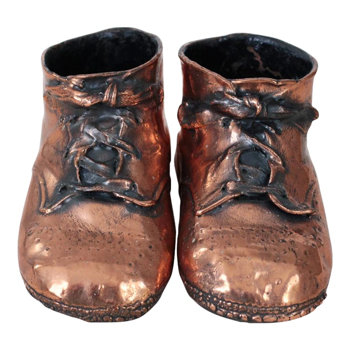 Mid-Century Copper Bronzed Baby Shoes, Vintage Nursery Decor: A charming pair of mid-century bronzed baby shoes, preserved in warm copper tones with softly aged patina. Life-size original leather booties coated in a layer of copper through an electroplating