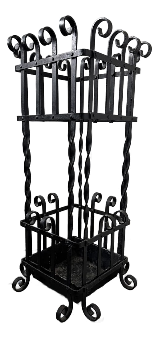 Mid 20th Century Black Wrought Iron Metal Umbrella Stand: Listing is for a black wrought iron metal umbrella stand with twisted spires having curlicue scrolled ends. 26.5" tall and the base is 12.75" and interior is about 8.5" Condition: Alterations: