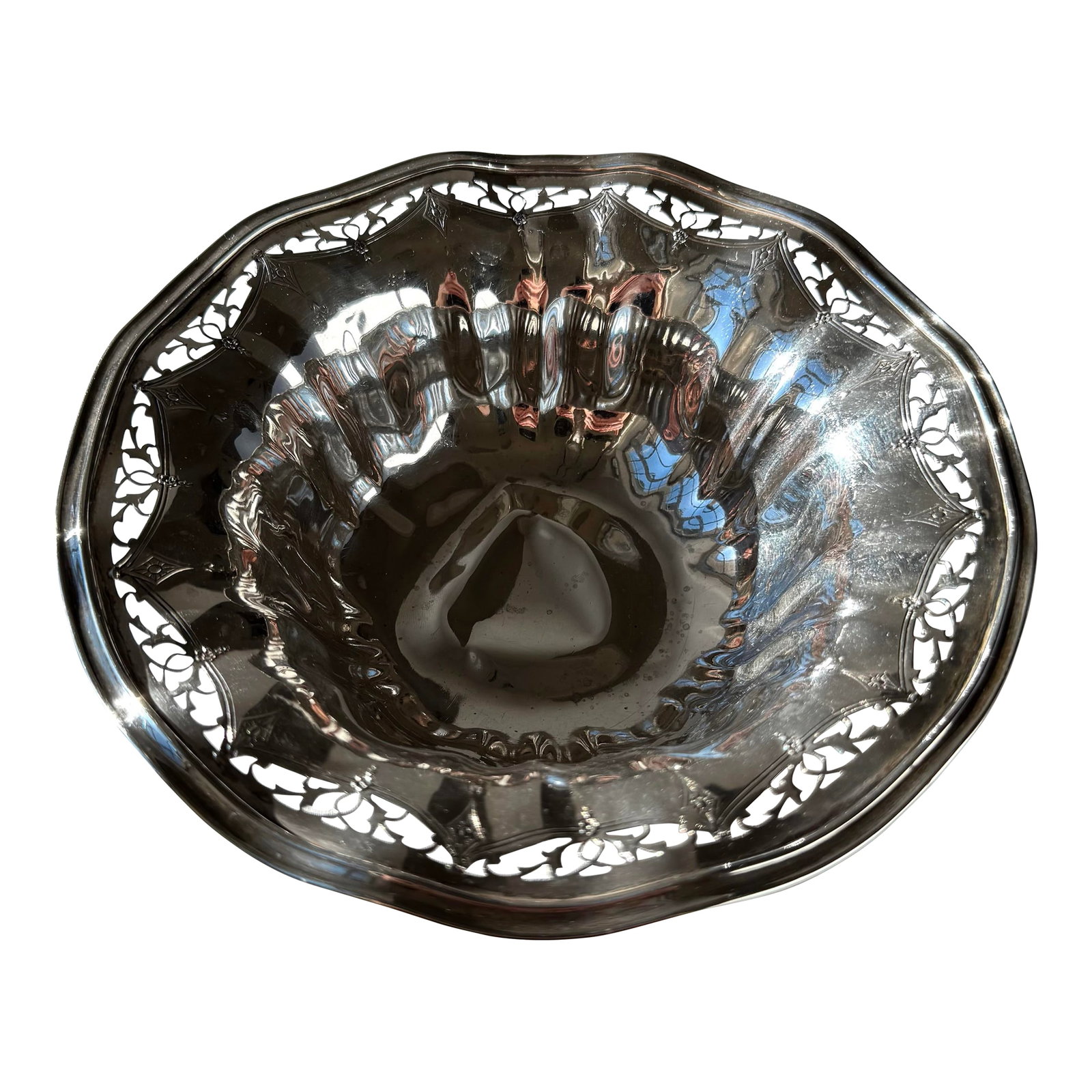 Antique Sterling Silver Bowl With Pierced Rim and Floral Scrollwork: Antique sterling-style silver bowl featuring an intricately pierced rim adorned with detailed floral and scrolling motifs. The openwork border showcases fine craftsmanship, while the gently scalloped