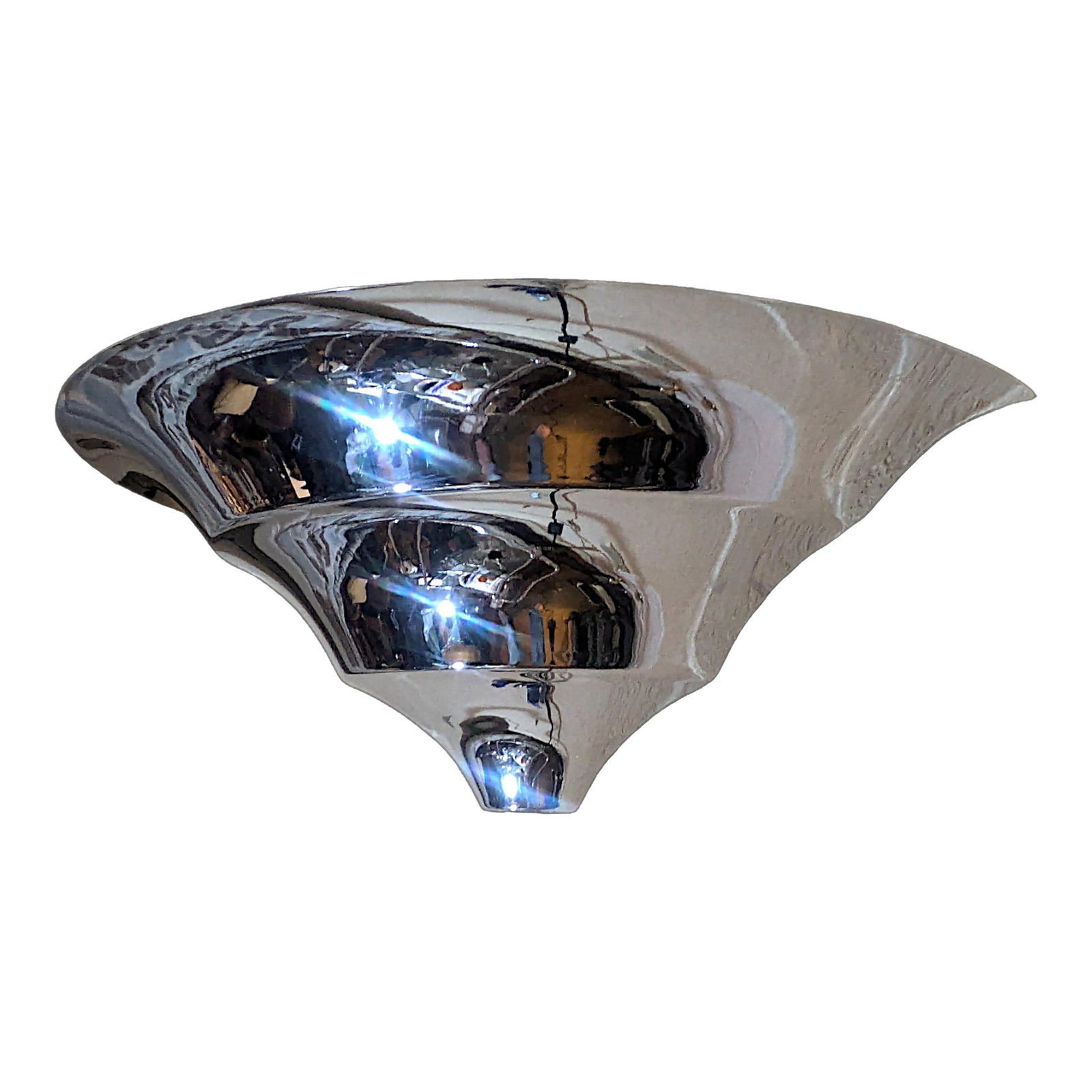 1930s Art Deco Demilune Wall Sconce Attributed to Jean Perzel: A chromed steel demilune Art Deco wall sconce featuring a Streamline Moderne design with 3 round steps which cascade to a coned point. The sconce is very reminiscent of the designs done by Jean Perzel
