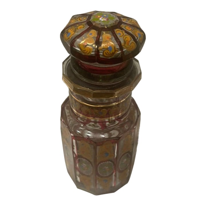 Antique Hand-Painted Bohemian Glass Perfume Bottle: Exquisite antique Bohemian glass perfume bottle featuring richly colored ruby and clear faceted glass, lavishly hand-painted with gilt scrollwork and delicate floral medallions. The body and stopper