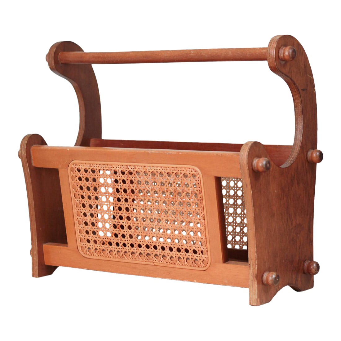 1970s Mid-Century Wood and Cane Magazine Rack: This vintage wooden magazine rack features woven cane panels, rounded peg accents, and a sculptural silhouette. A beautiful blend of mid-century warmth and boho charm, it's perfect for holding