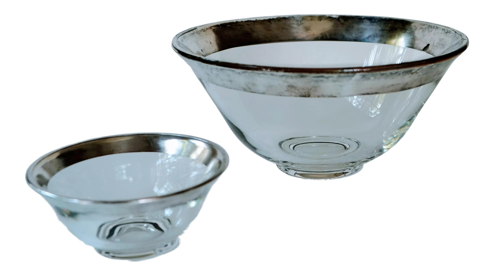 Vintage Dorothy Thorpe Silver Rimmed Serving Bowls- 2 Pieces: Pair of vintage silver rimmed nesting serving bowls designed by Dorothy Thorpe. Large bowl: 10.25 in diameter, 4.75 in H; small bowl: 5.5 in diameter, 2.5 in H. Silver rim is chipped and tarnished in