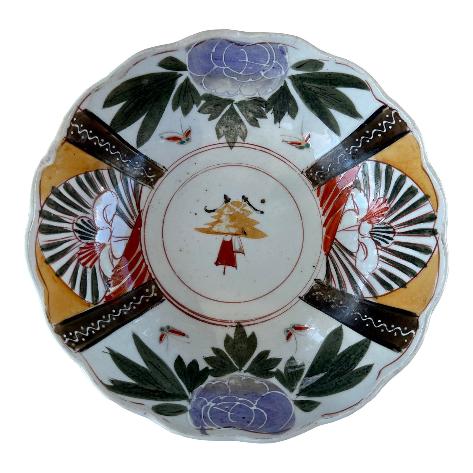 1890 Antique Japanese Imari-Style Scalloped Bowl With Floral & Fan Motifs, Meiji-Taisho Period: This antique Japanese porcelain bowl features classic Imari-style decoration, hand-painted in an earthy palette of iron red, mustard yellow, deep green, indigo blue, and soft lavender. The interior
