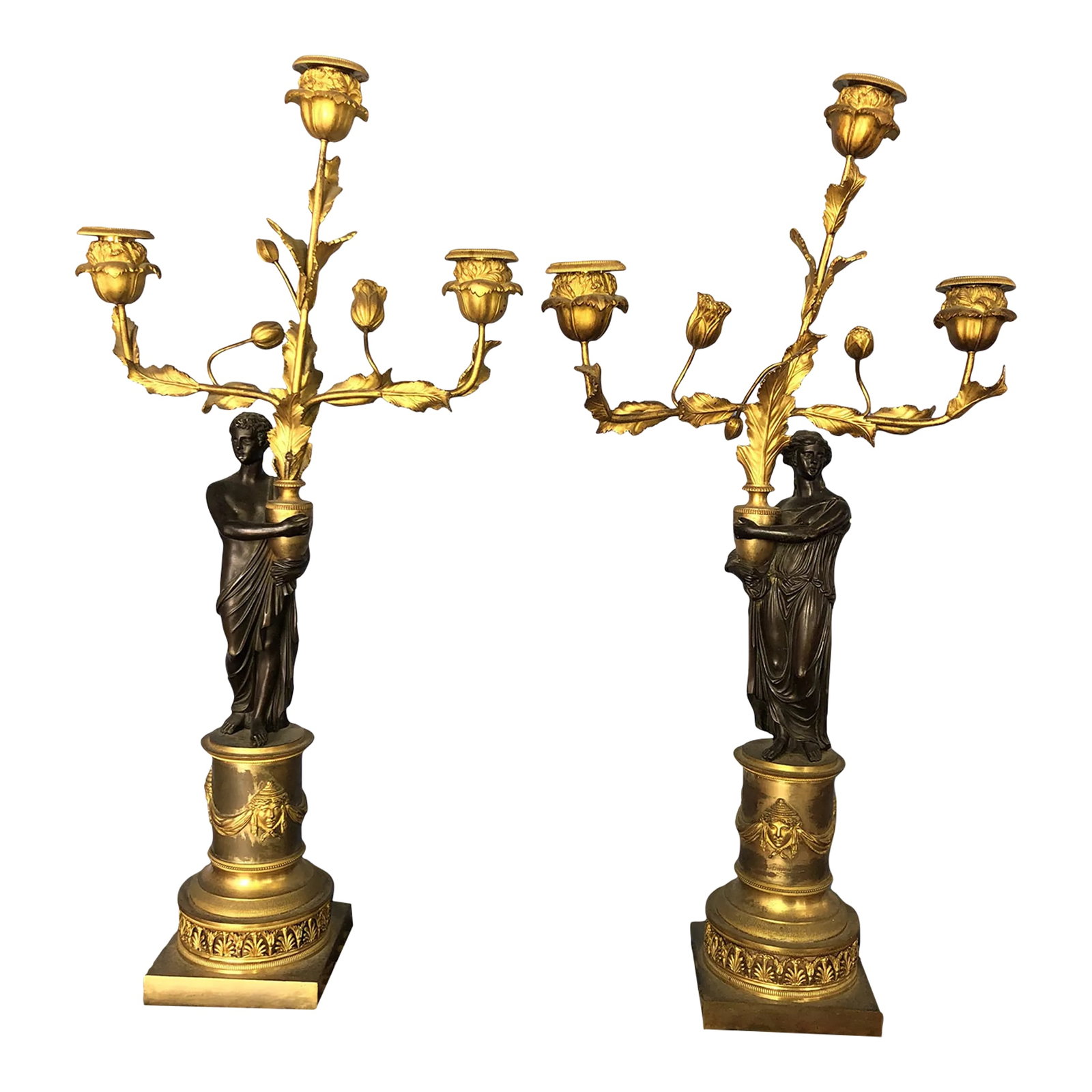 Early 20th Century French Bronze Torcheires - a Pair: A very large and heavy pair of antique bronze French figural torchieres. This is a beautifully aged pair of 3 light candelabras that was brought back from Paris, France back in the 1970s. They are lat