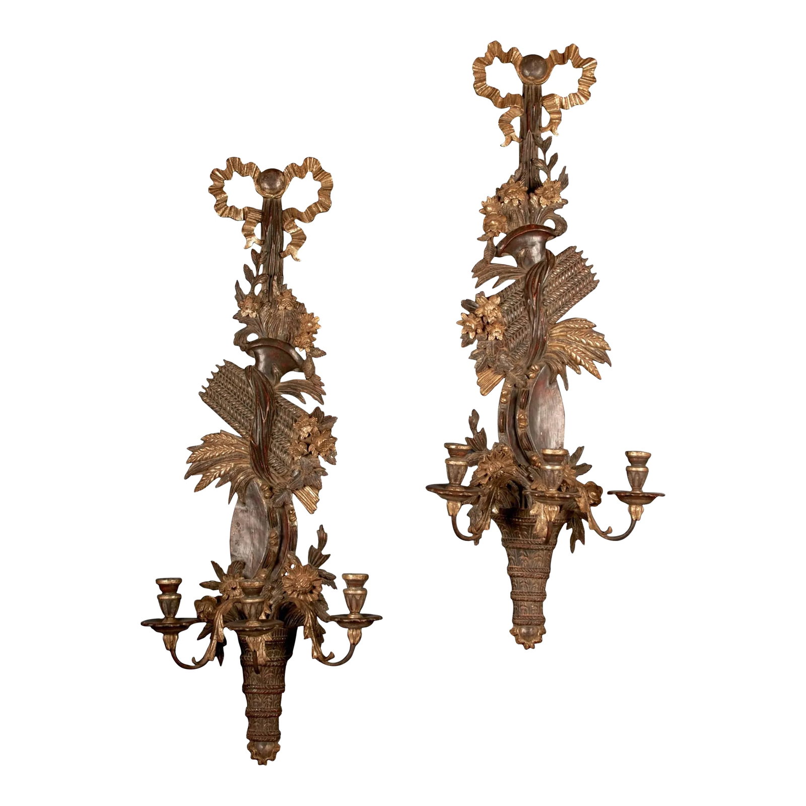 19th Century English Regency Carved Giltwood Sconces or Wall Appliques - A Pair: This monumental pair of three-light sconces is hand-carved in mahogany and gilded with yellow and white gold. The delicate ribbon winds upward from the candle cups and ties the bundle of wheat