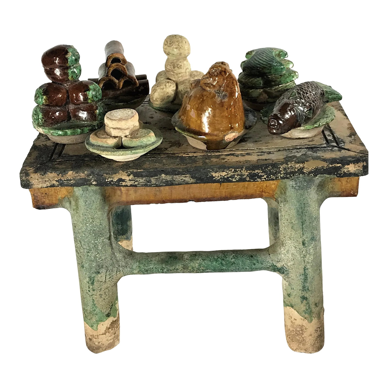 Painted Pottery Altar Table With Food and Wine Offerings From the Ming Dynasty - 8 Piece Set: The green glazed altar table is a scaled down model with recessed legs and simple spandrels supporting a top piled high with plated delicacies, a chickem, a whole fish, pastries, cakes made from a