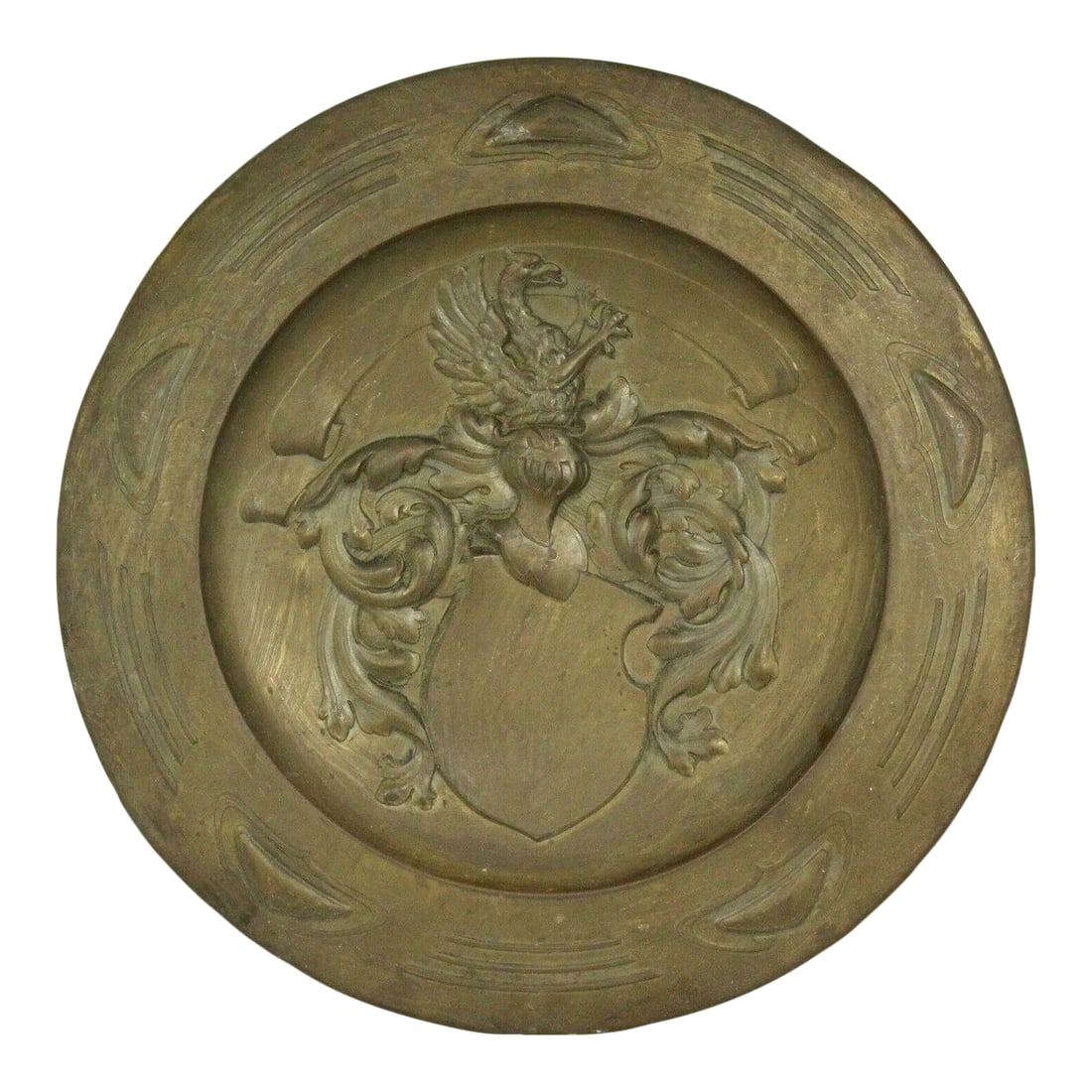 1800's Arts and Crafts Art Nouveau Brass Wall Charger Platter With Embossed Coat of Arms: Avery impressive armorial wall decoration A brass charger / platter, decorated with beautifully embossed Coat of Arms depicting a griffin over a knight's helmet surrounded by feathers or acanthus