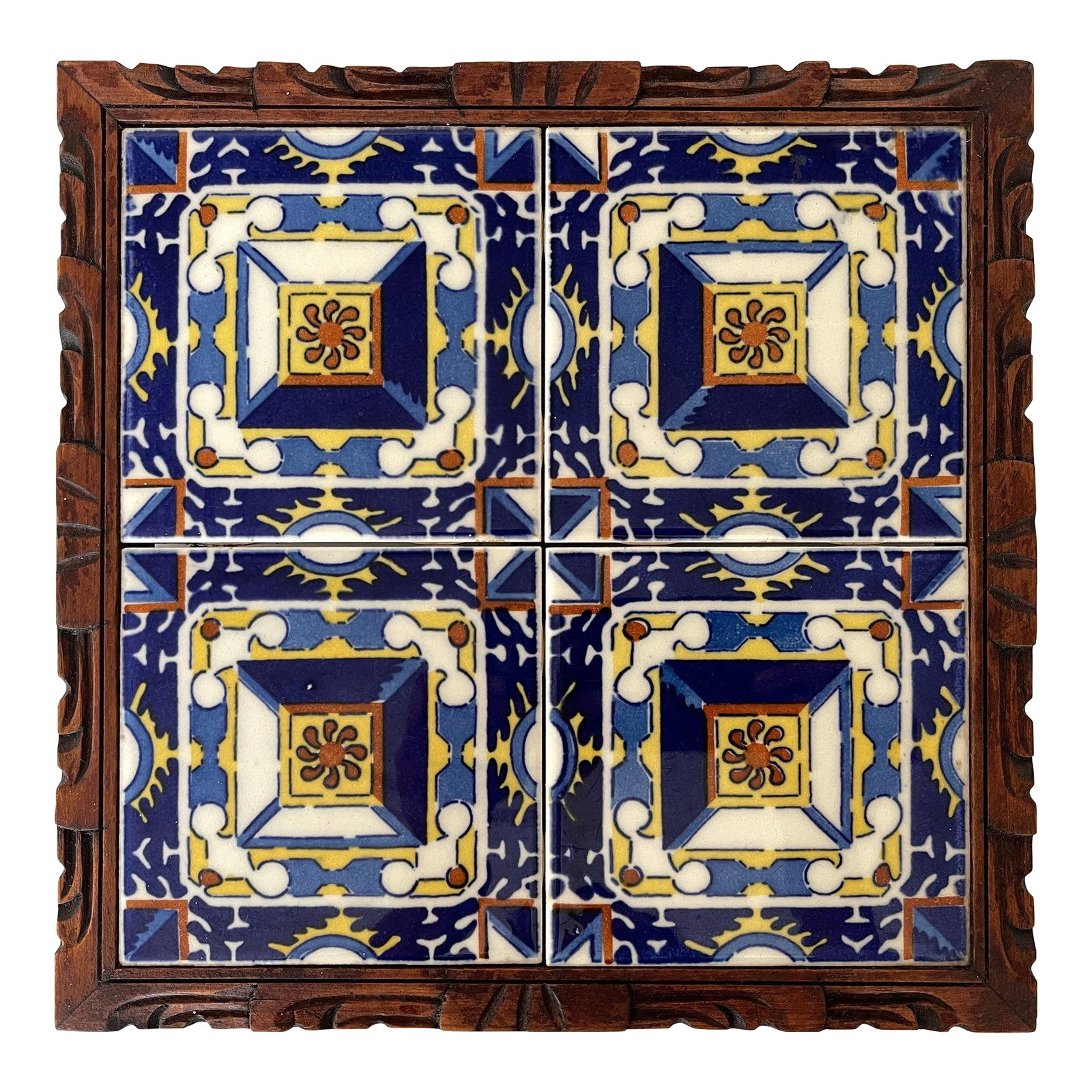 1950s Mexican Hand Carved Wood Frame Base Tile Trivet: 1950's Mexican tile square trivet tray with richly colored ceramic tile set in a hand carved wood framed footed base. Condition: Alterations: Original Condition Unaltered Imperfections: Some