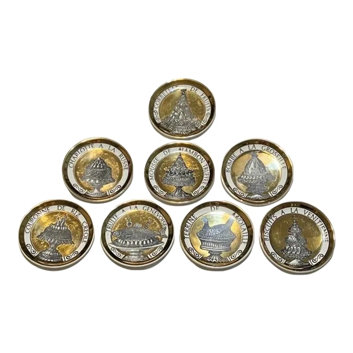 1950s Fornasetti "Dinner at Eight" Coasters - Opulent Gold - "Pranzo Alle Otto"- Set of 8: 8 Fornasetti "Dinner at Eight" Coasters - Opulent Gold - "Pranzo alle Otto" Set of eight mid-century modern Fornasetti Italian gold coasters decorated with obscenely rich food. Marked "Fornasetti