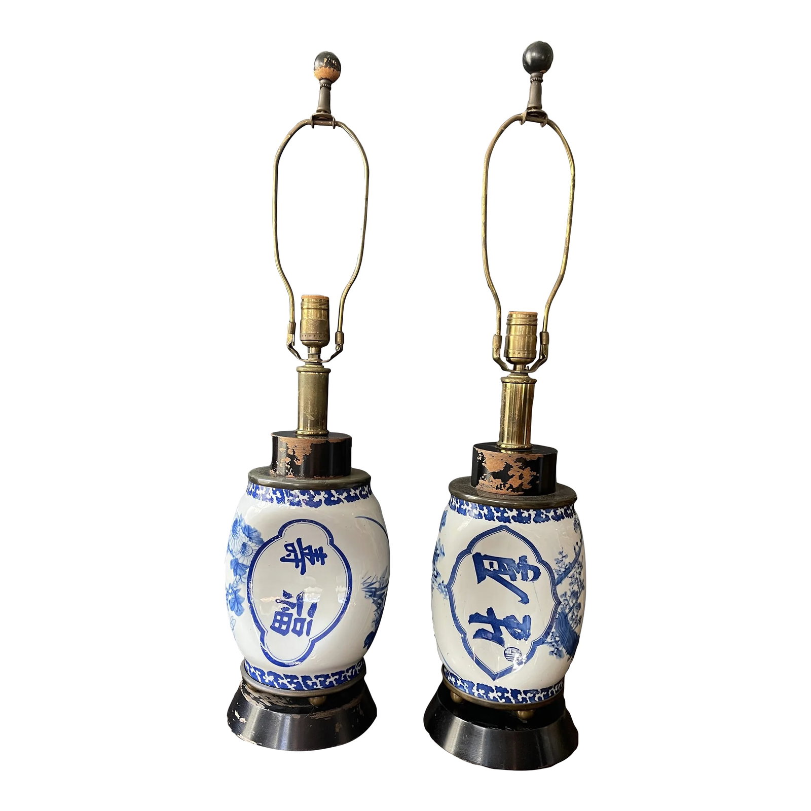 Mid Century Blue and White Chinese Ceramic Lamps - a Pair: Wonderful old Chinese ceramic pillow or head rests that have been converted to table lamps mid-20th century. The ceramics predate the lamps, and are much older. Crisp white with a vivid and rich royal