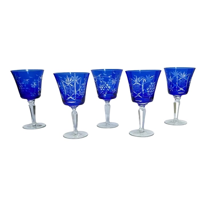 Cobalt Blue Cut to Clear Crystal Glasses- Set of 5: Set of 5 Cobalt blue stemmed cut to clear wine crystal. Grapes, stars, and fan cut motif. Excellent condition of 4 One has a minor chip on the rim See last photos Condition: Alterations: Original