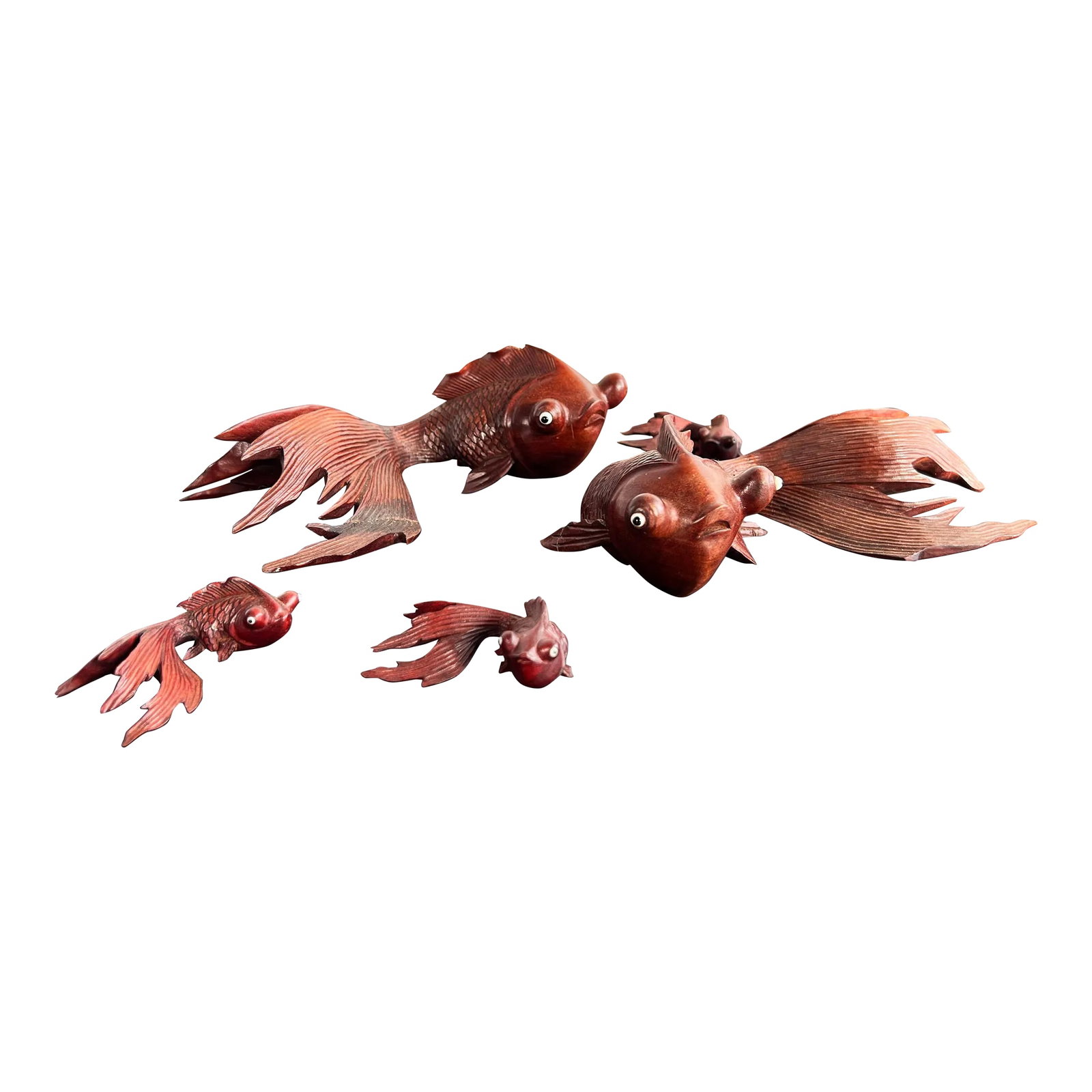 Vintage Set of Japanese Hand Carved Swimming Koi Fish - Set of 5: Fabulous set of 5 vintage hand carved fancy tail koi fish from Japan! Great form to them, all hand carved, with inset glass eyes. They measure from 2 3/4" by 1 7/5" wide and 1 1/8" tall on the small o