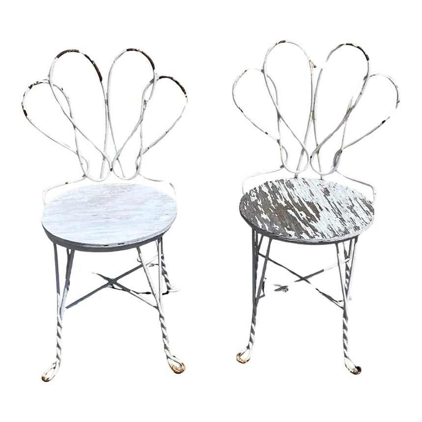 Antique French Bistro Twisted Wrought Iron Ice Cream Parlor Chairs - a Pair: Antique French Bistro Twisted Wrought Iron Ice Cream Parlor Chairs - a Pair. Circa Early 20th Century. Measurements: 32.5" H x 18.5" W x 17" D x 17" Seat height. Condition: Alterations: Original Condi