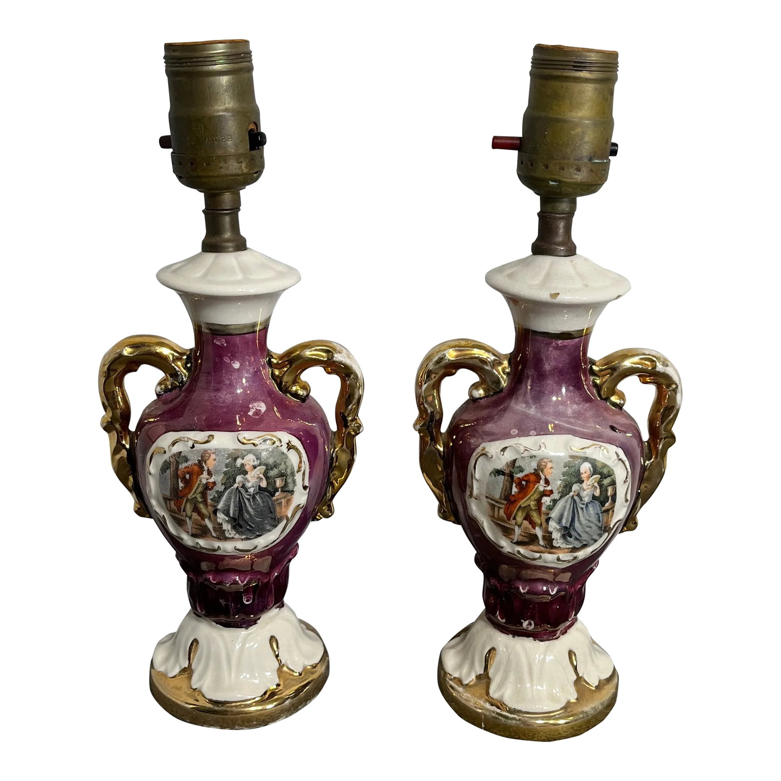 Pair of Mid 20th Century Smaller French Victorian Style Porcelain Table Lamps: Attractive pair of table or desk lamps. Soothing lavender color with cream and gold. Dual handled vase like form with a luster glaze. Condition: Alterations: Original Condition Unaltered Imperfections