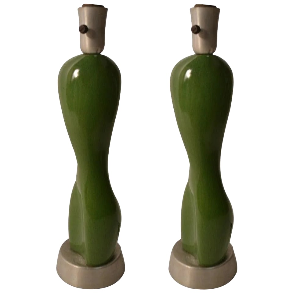 Russel Wright Ceramic Nude Form on Spun Aluminum Base - a Pair: Pair Russel Wright ceramic nude table lamps. The ceramic body is mounted on its original spun aluminum base, with the original spun aluminum socket sleeve, and original parchment shades. The shades ar