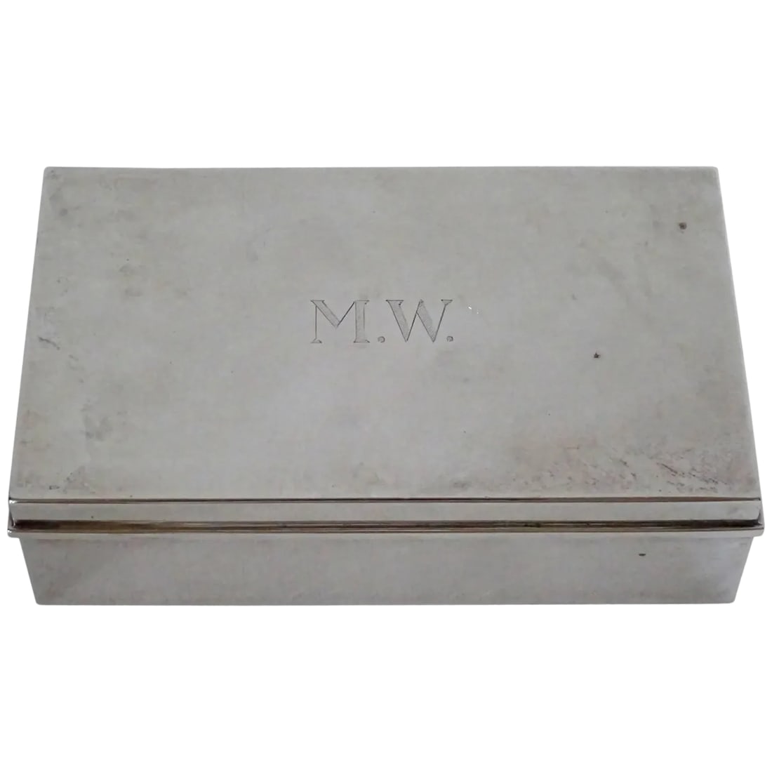Tiffany & Co. Sterling Silver Cigarette Box: Handsome sterling silver Tiffany & Company cigarette box. Monogrammed "MW." Wood lined. Sterling silver with Tiffany & Co. mark on the bottom of the box. Monograms can be removed by a silversmith. No