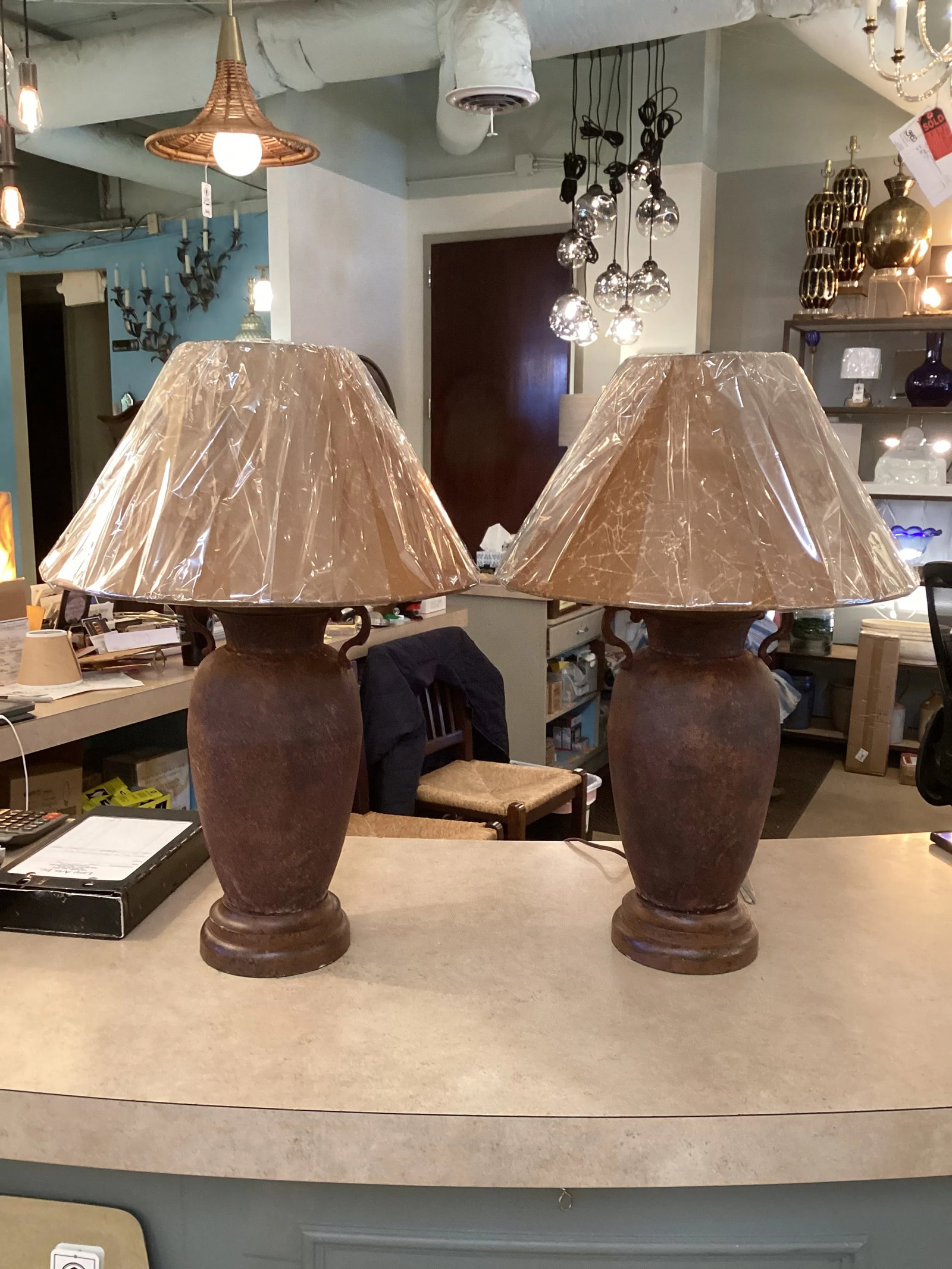 Pair of Late 20th Century Rusted Urns Mounted as Lamps With Crinkled Parchment Shades - 2