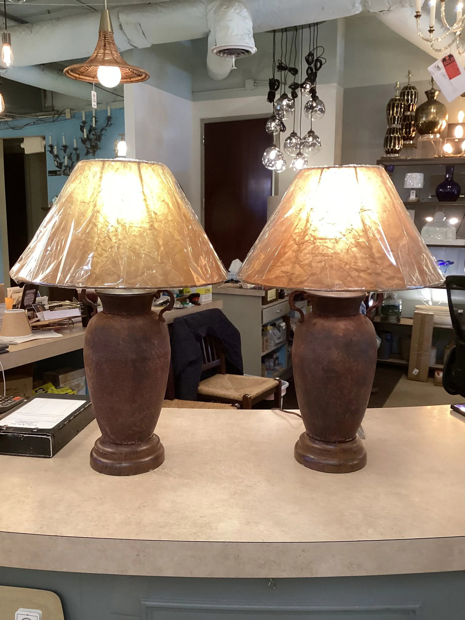 Pair of Late 20th Century Rusted Urns Mounted as Lamps With Crinkled Parchment Shades - 3