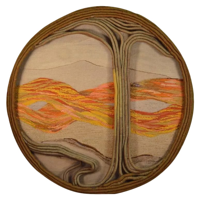 Over Scale Textile Art "Tree of Life": 70"- Diameter wall hanging 3-D macrame sculpture. Late 70's "Hippie Style" decorative art depicting a tree with mountains in the background. The piece has a small brass tag which reads "Another World