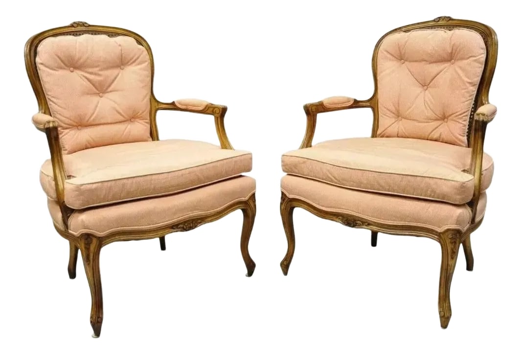 Early 20th Century French Louis XV Provincial Style Carved Walnut Cane Back Arm Chairs - a Pair: Vintage French Louis XV Provincial Style Carved Walnut Cane Back Arm Chairs - a Pair. Item features cane backs, solid wood frame, upholstered armrests, nicely carved details, cabriole legs, very nice 