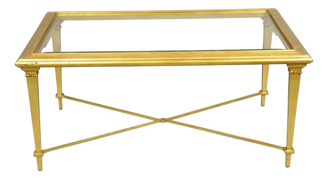 Hickory Chair French Hollywood Regency Gold Rectangular Bristol Coffee Table: Decorator French Hollywood Regency Style Gold Leaf Rectangular Beveled Glass "Bristol" Coffee Table with Iron Stretcher by Hickory Chair. Circa 21st Century. Measurements: 19" H x 42" W x 26" D. Condi