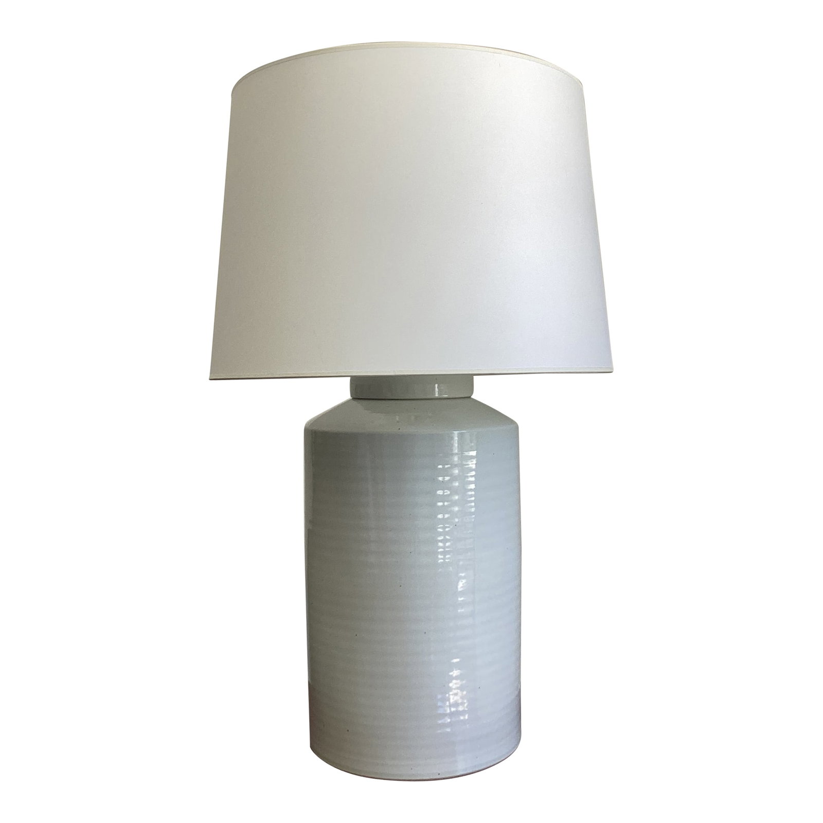Ralph Lauren Home Large Classic Cylinder Lamp: Classic and understated, this Ralph Lauren Home table lamp brings refined simplicity to any space. The cylindrical ceramic base, finished in a soft white glaze with subtle horizontal striations. Its c