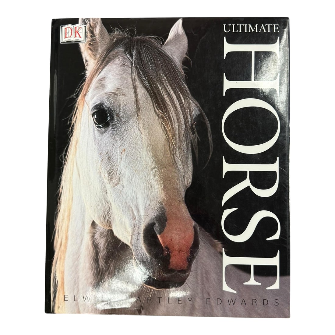 Ultimate Horse Coffee Table Hardcover Book 2002: "Ultimate Horse" by Elwyn Hartley Edwards, a comprehensive guide to horses. This book covers various aspects of the equestrian world, including the history and domestication of horses, a photographic