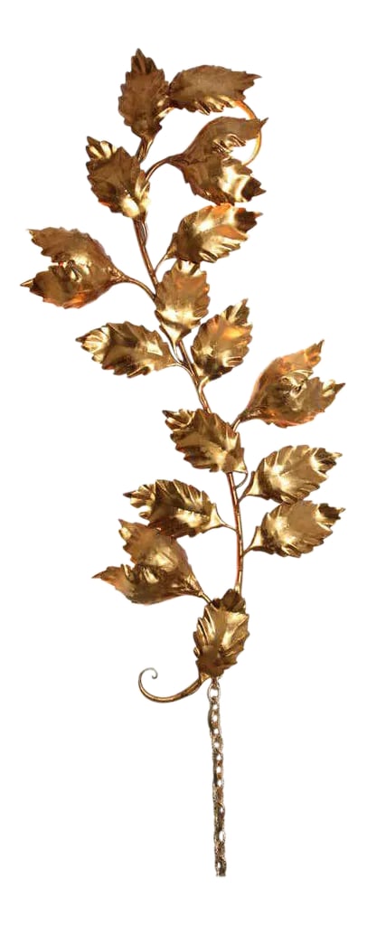 1960s Italian Hollywood Regency Gilt Metal Wall Sconce by S. Salvadori: An Italian 1960s Hollywood Regency gilt metal wall sconce in the form of a branch with leaves. This large decorative gold leaf sconce makes an ideal feature piece for a traditional or contemporary int