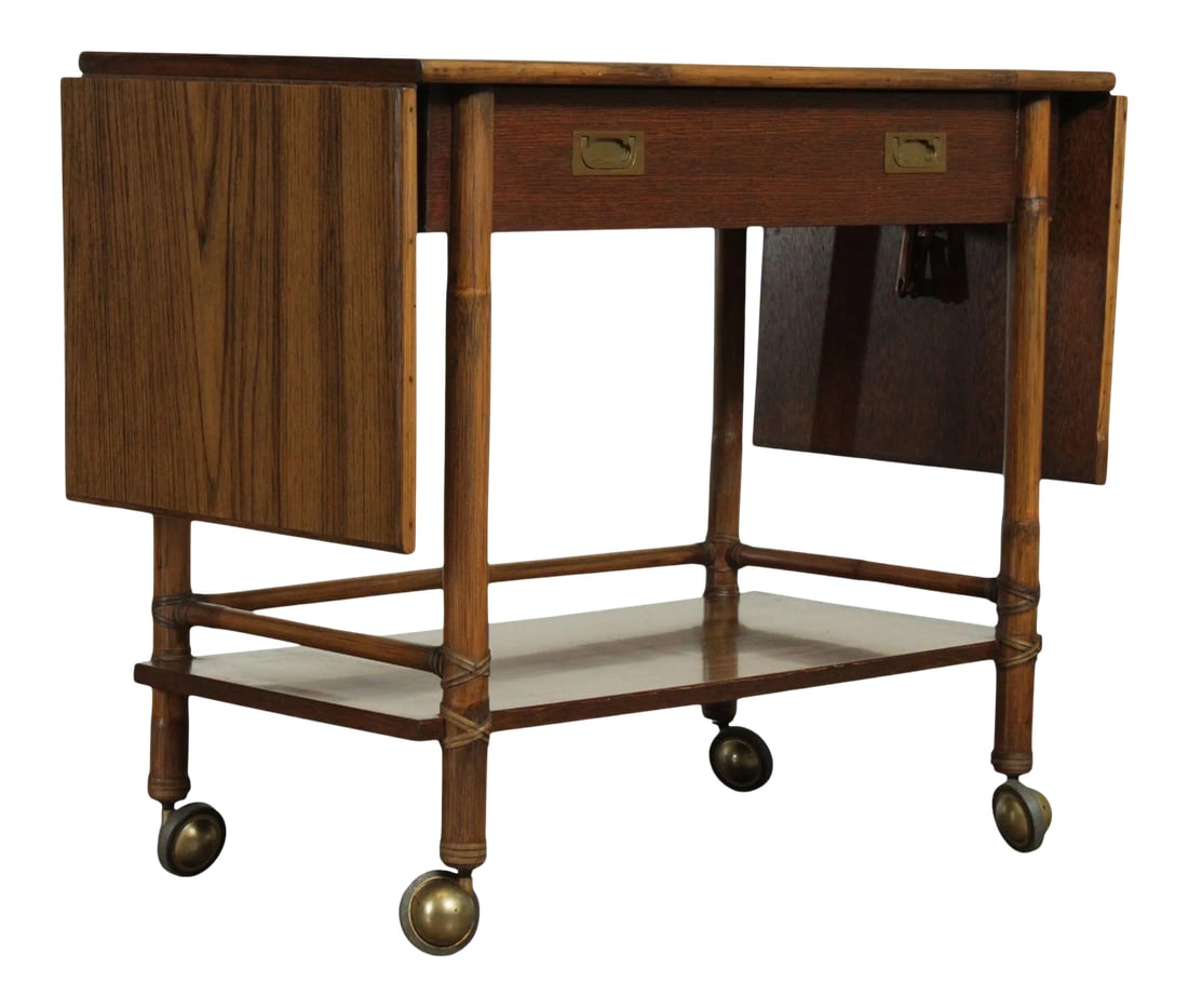 McGuire of Sanfrancisco Vintage Rattan Drop Leaf Bar Cart Server: High Quality American Made Vintage Rattan Server on Rolling Casters, Rawhide Lacing, Oak Drawer Front, Recessed Hardware, Faux Wood Grain Laminated Surfaces Condition: Alterations: Original Condition 