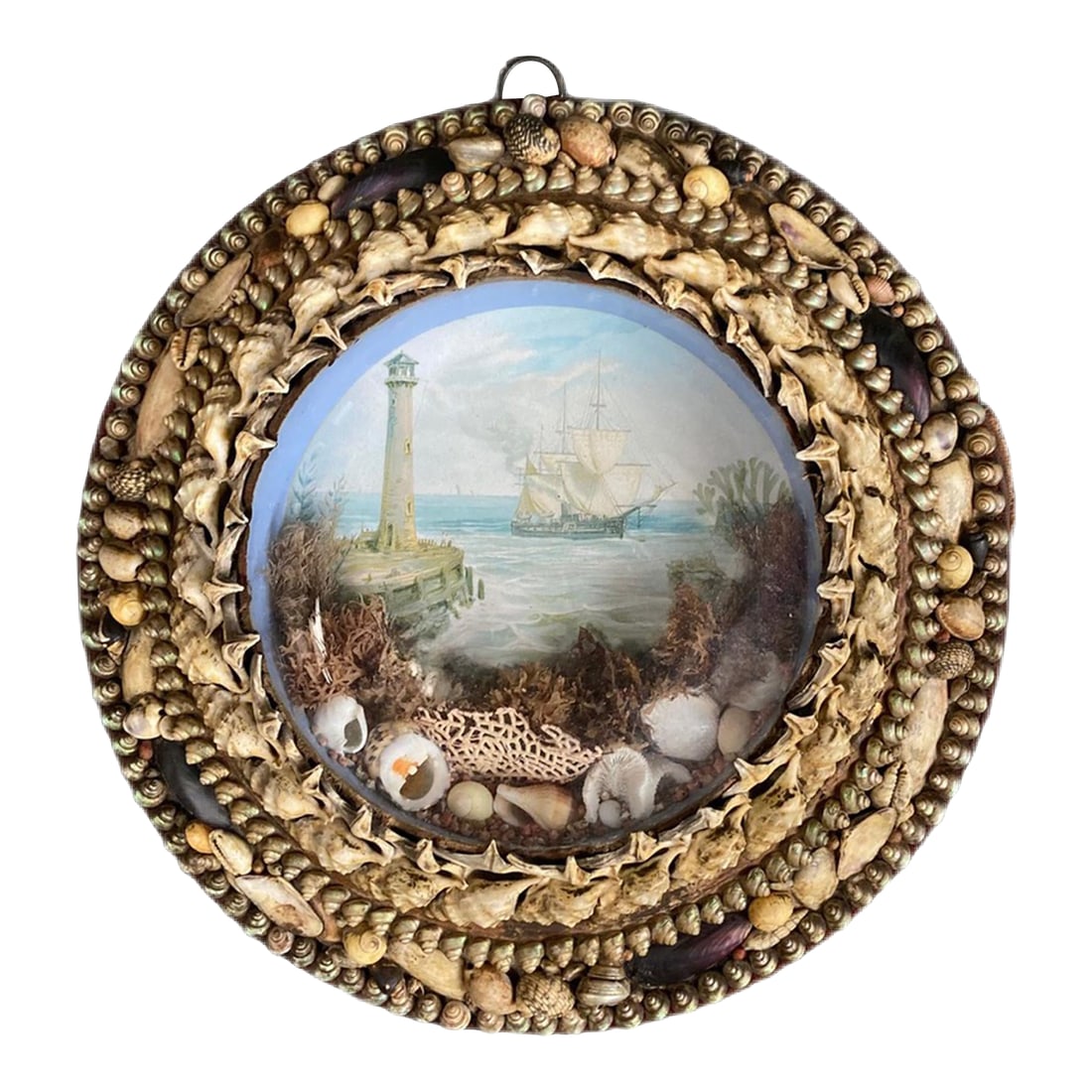 Edwardian Shellwork Valentine Diorama of a Ship Passing Lighthouse: Edwardian Shellwork Valentine Diorama of a Ship Date: Circa 1900 Origin: England Materials: Shells, coral, seaweed, chromolithograph, wood, glass Dimensions: 10 3/4 inches diameter x 2 inches deep