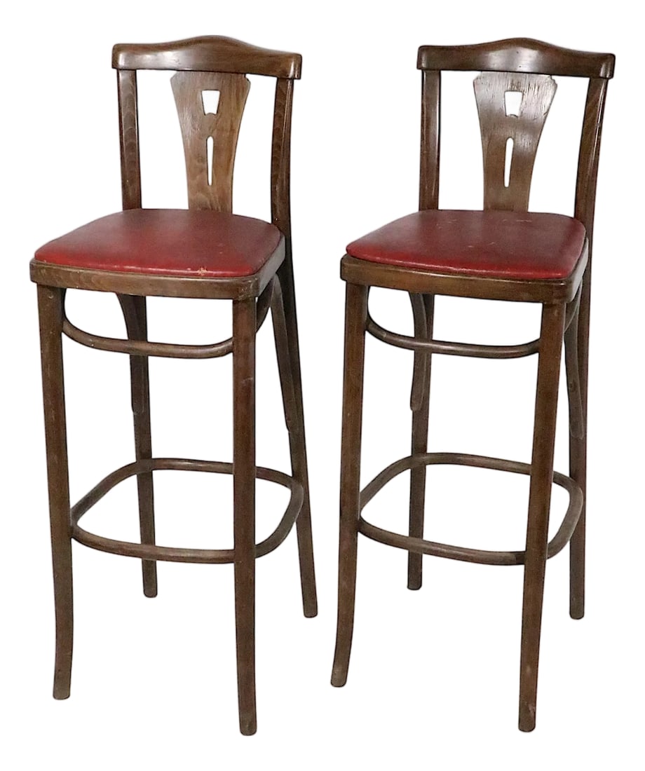 Mid 20th Century Pr. Bentwood Counter Stools by Thonet: Pair of early - mid 20th century bentwood bar stools, by Thonet. The stools feature a pierce work slat back mounted in a classic Vienna Secessionist style bentwood frame, with original vinyl seat pads