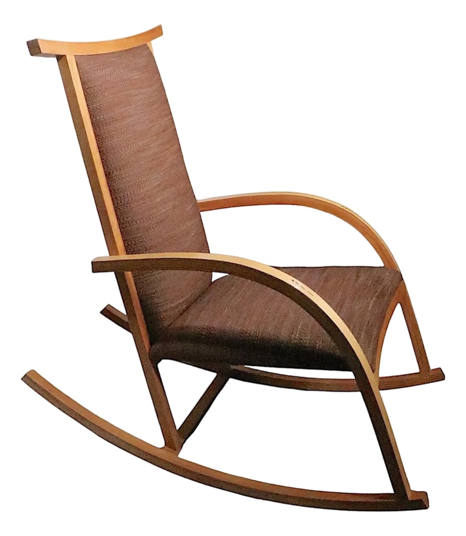 Knoll Carlos Riart Barcelona Rocking Chair C. 1980's: Chic 1980's vintage Barcelona rocking chair, designed by Carlos Riart for Knoll, circa 1980's. This example features a light wood finished frame with brown/orange toned fabric upholstery, it is decora