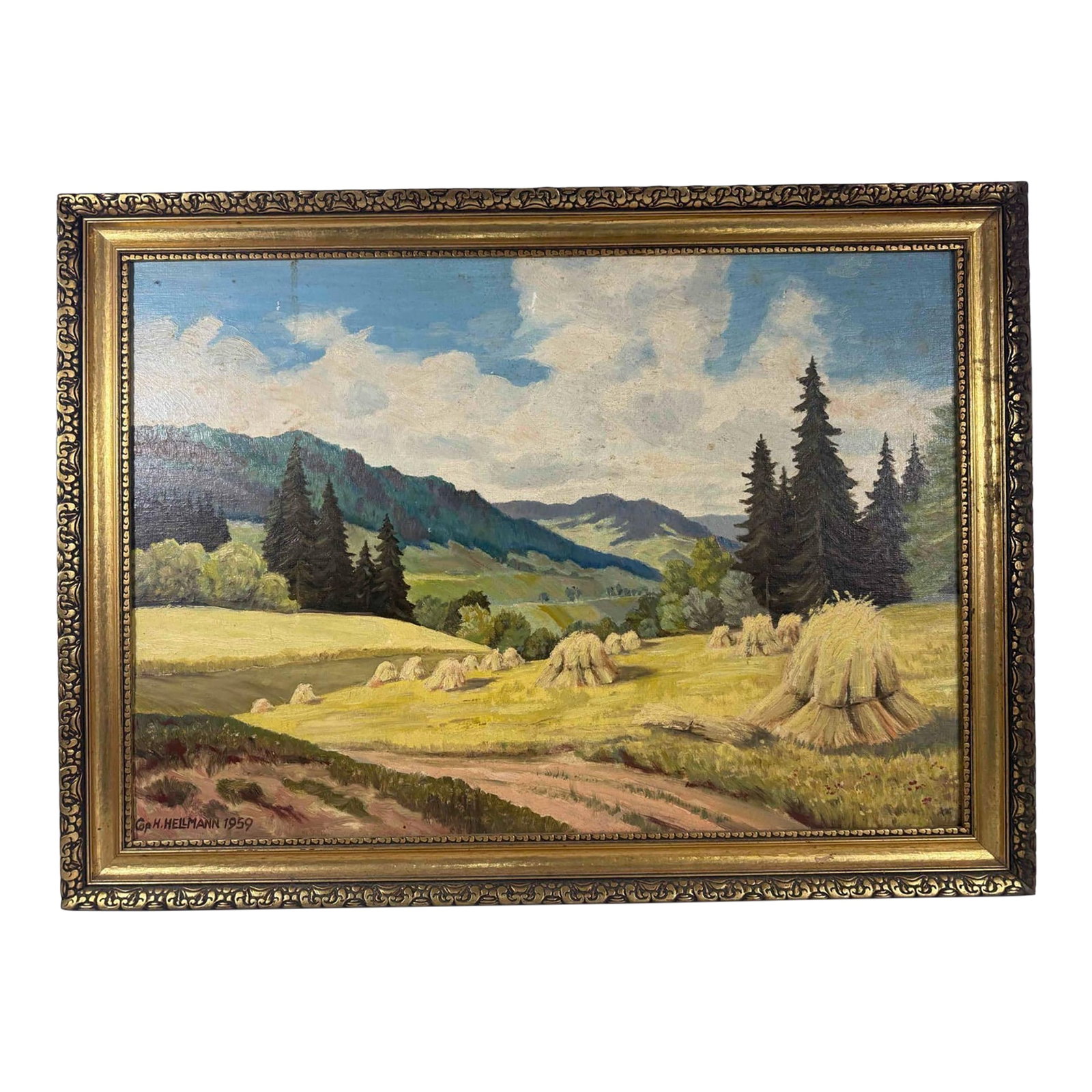 Signed 1959 H. Hellmann Mountain Landscape Painting: A striking and expansive 1959 mid-century original landscape oil painting on board capturing a tranquil country road winding through sunlit fields toward a dramatic mountain range. Beautifully