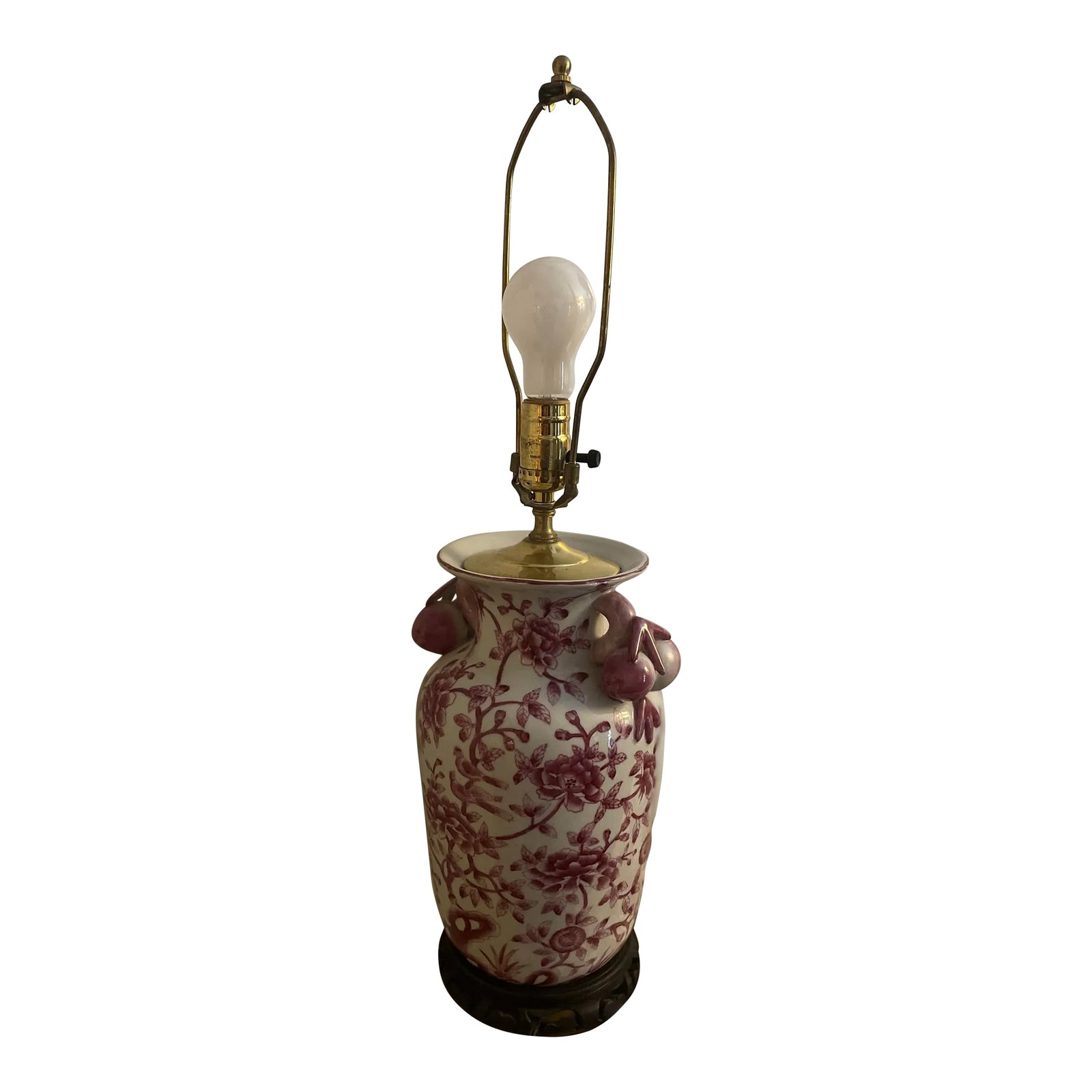 Chinese Chinoiserie Porcelain Ceramic Lamp in Pink and Red: A beautiful statement in a color I would call raspberry with shades of pink and red. Its an excellent excellent of a Chinese chinoiserie porcelain or ceramic lamp. In excellent shape with a carved woo