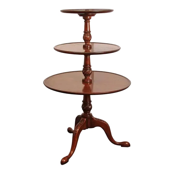 Late 18th Century George II Mahogany Dumbwaiter: A fine George II mahogany dumbwaiter, the three-tier graduated dumbwaiter with dish top shelves, a tapered central pedestal with carved spiral-turned urns, on cabriole legs with carved bellflowers.