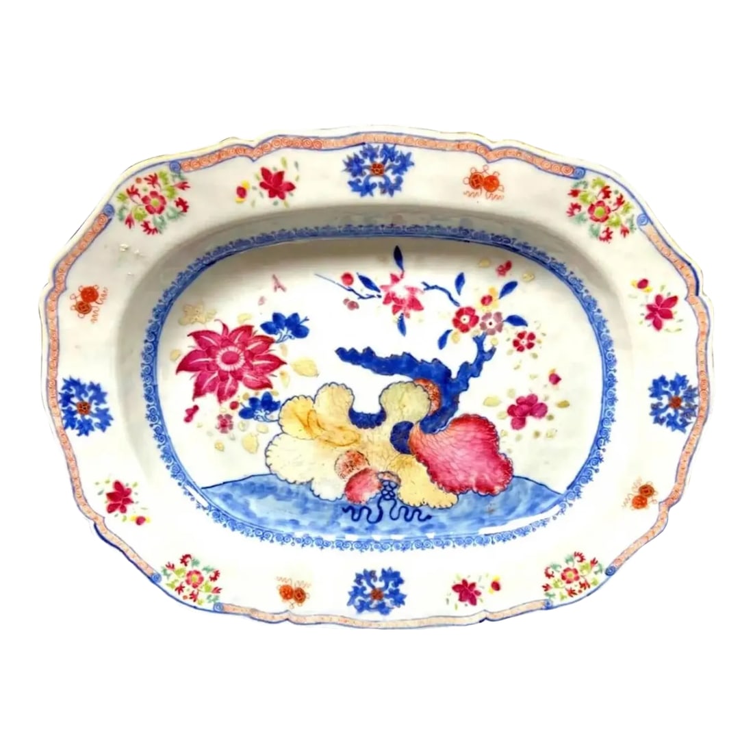 Antique Chinese Export Porcelain Famille Rose Platter: A large Chinese Export Famille Rose charger with pink lotus and other flowers. Painted in bright vivid colors of blues, reds and yellow accents. Condition: Alterations: Original Condition Unaltered