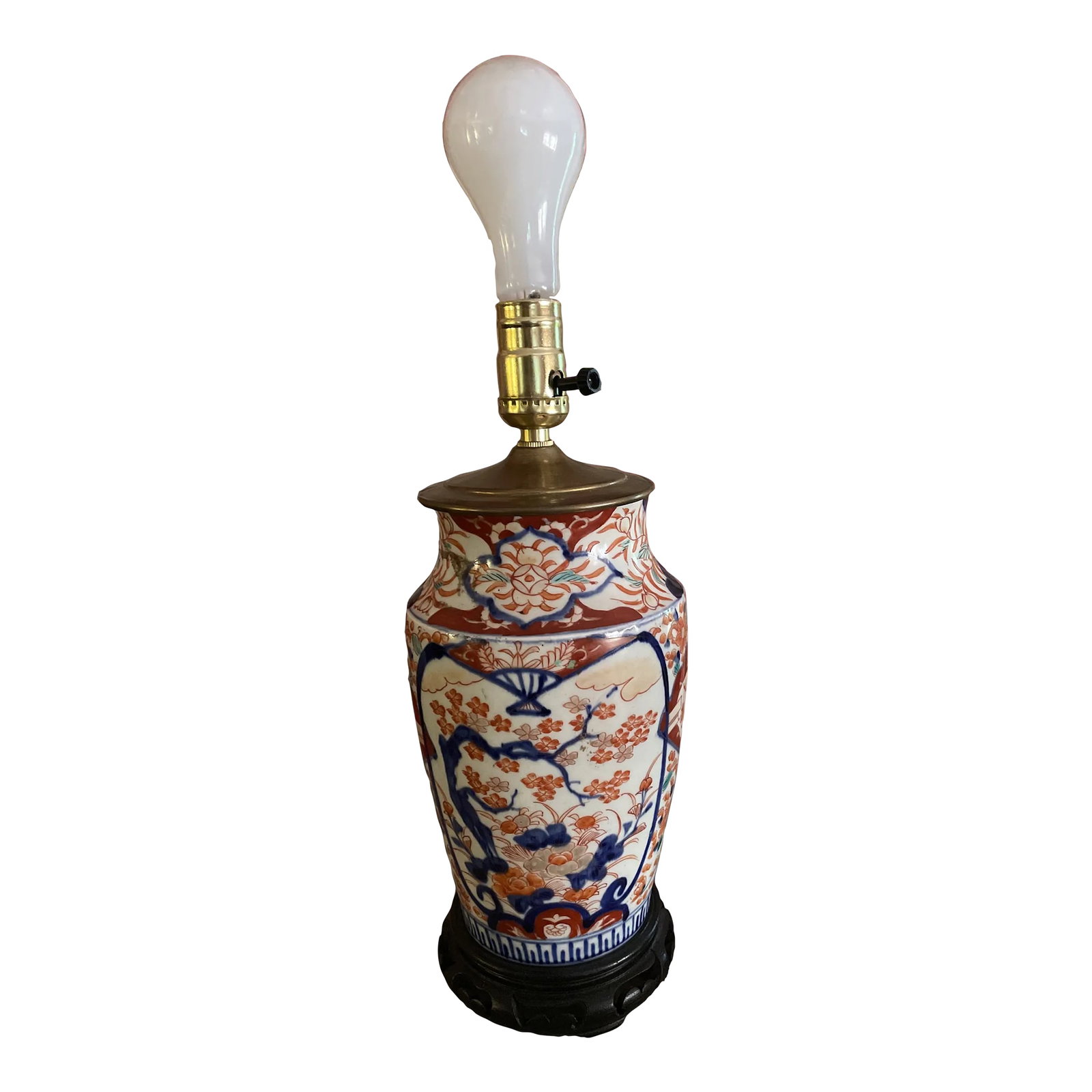 Japanese Imari Style Porcelain Ceramic Table Lamp With Wooden Base: A very decorative modern ceramic table lamp. In the Japanese Imari pattern with a wooden base. Condition: Alterations: Original Condition Unaltered Imperfections: Some Imperfections Condition Notes: I