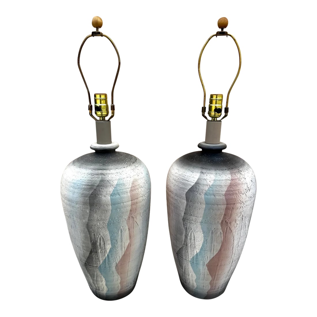 Vintage 80's Casual Lamps Co. Plaster Table Lamps-A Pair: Amazing Casual Lamp Co. Plaster Table Lamps with a southwest look. Colors from black, peach, teal and mauve with a background in cream. Pitted effect on lamps Makers mark next to cord on side of