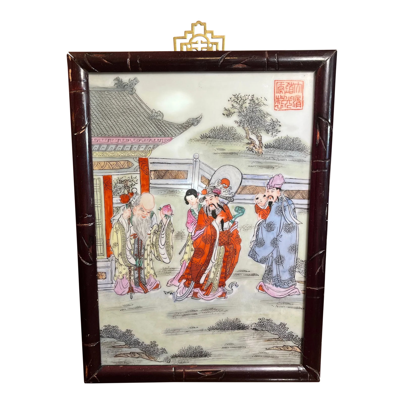 Mid 20th Century Chinese Famille Rose Porcelain Wall Plaque: Hand painted porcelain framed and presented as a wall plaque. Cute scene gathering around an old wiseman. I like how everyone's clothing is vibrant and the color pops nicely off a muted green backgrou