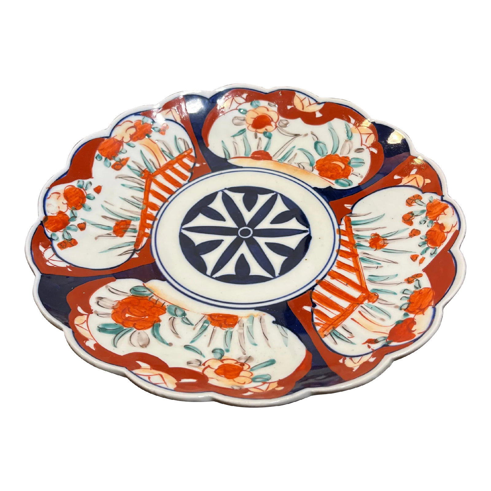 Antique Hand Painted Scalloped Japanese Imari Charger: Beautiful charger with scalloped edge and a whimsical floral motif. Rich colors of red and blue with highlights of burnt orange. Condition: Alterations: Original Condition Unaltered Imperfections:
