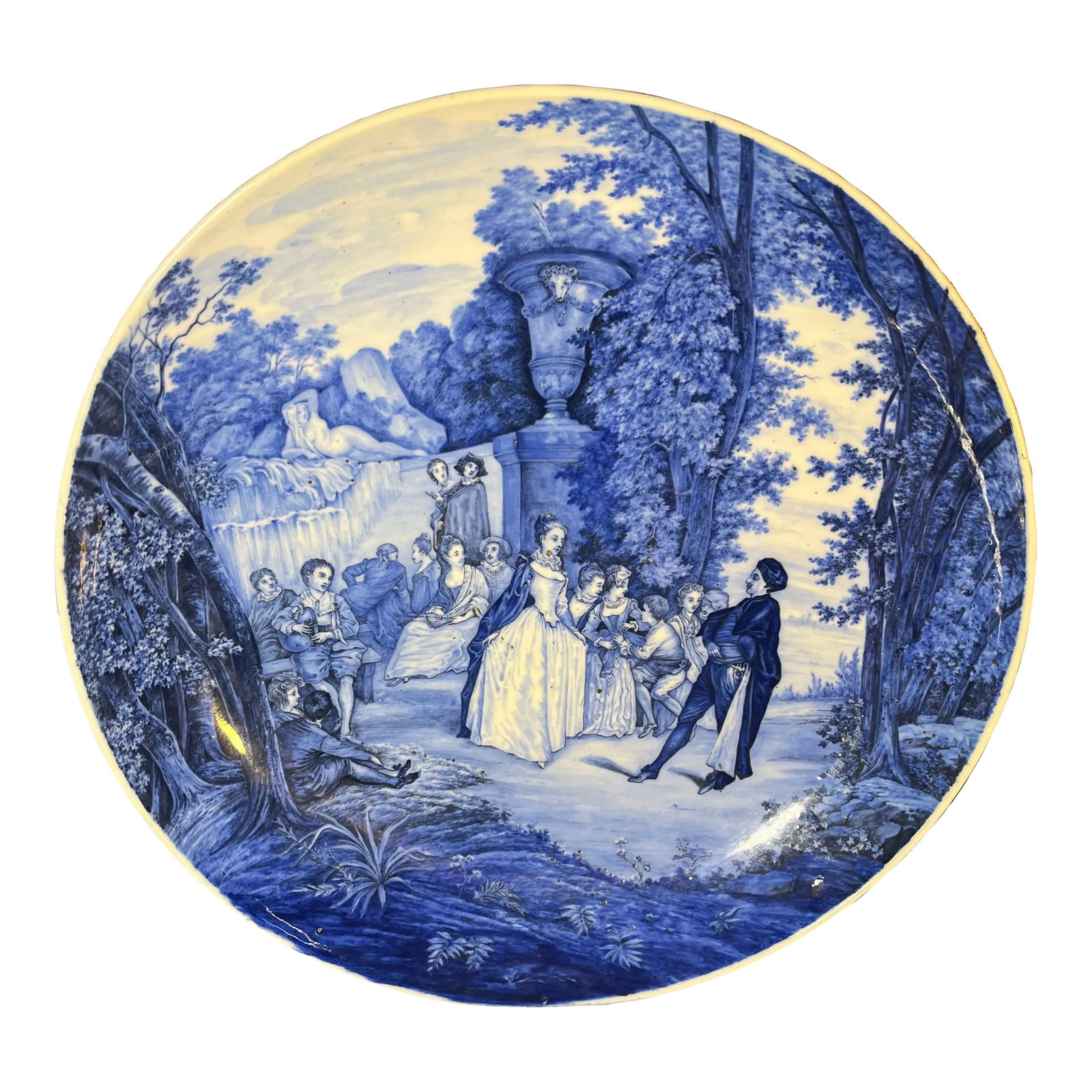 Antique Blue and White Porcelain Wall Plate: Late 19th Century; hand painted courting scene by urn and waterfall, stamped on reverse 265. Condition: Alterations: Original Condition Unaltered Imperfections: Some Imperfections Condition Notes: