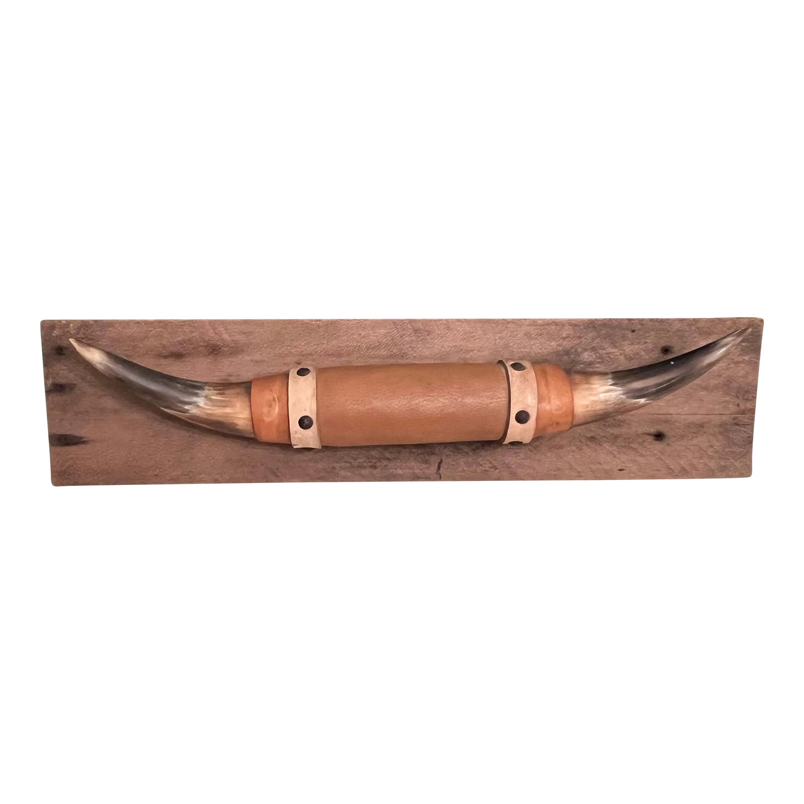 Vintage Mounted Bull Horns: Vintage pair of polished bull horns mounted on rustic barn wood. The middle is covered in leather with nail head accents. There is a hanger on the back of the wood. It appears you could remove the