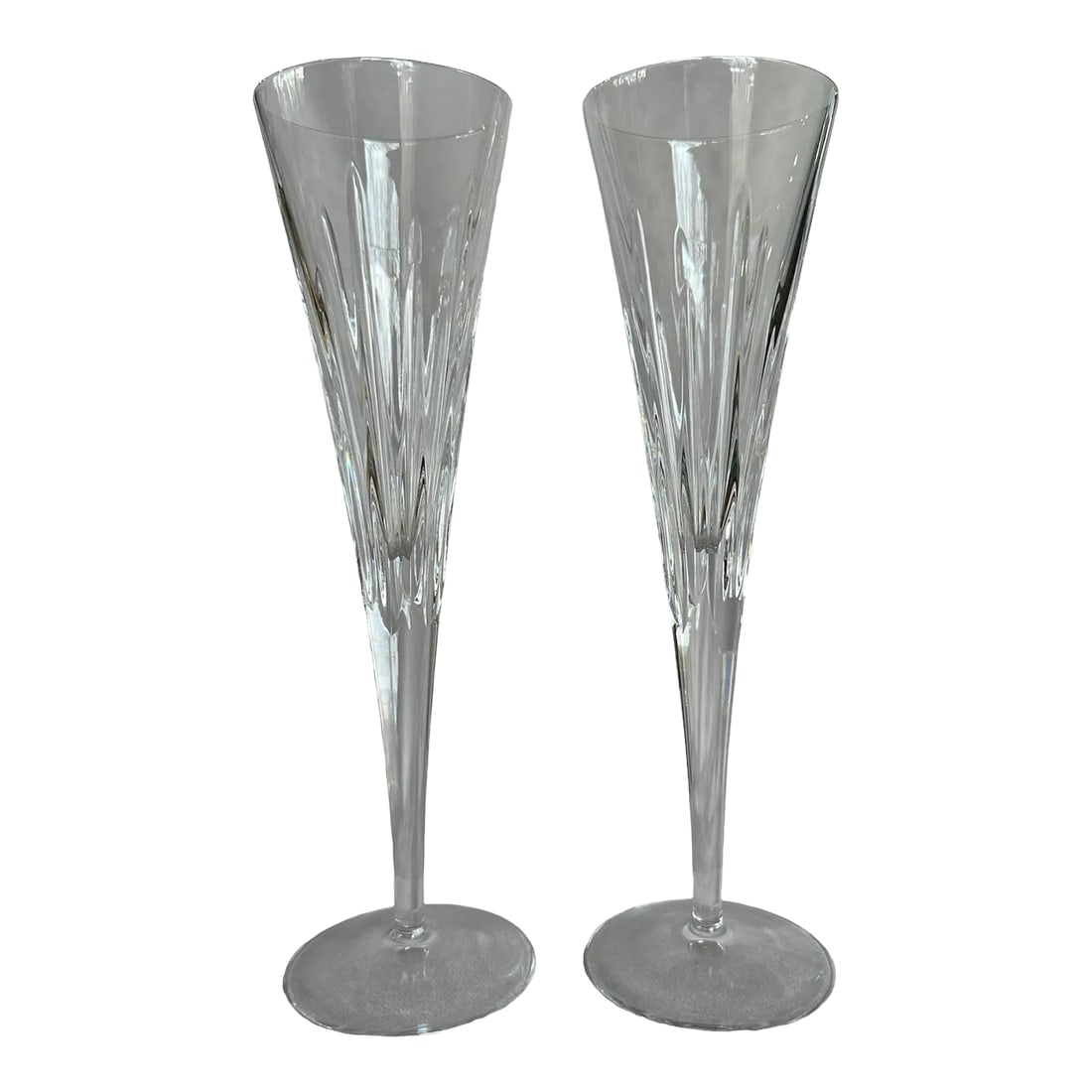 Late 20th Century Reed and Barton Soho Collection Crystal Champagne Flutes- a Pair: Part of the Soho Collection, this richly modern, mouth blown crystal flute set has a shimmering pattern of vertical lines that catches a sparkle evoking energy and light. The Soho Crystal Collection i