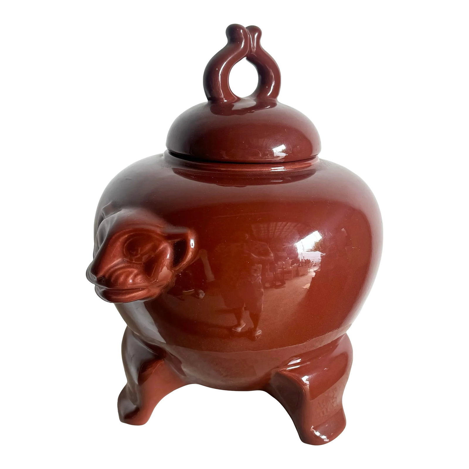 Vintage Oxblood Red Panther Face Ginger Jar by Jaru: This striking vintage ginger jar by Jaru features a rich oxblood red glaze and bold panther face accents, embodying a unique blend of elegance and character. With its sturdy tripod legs and