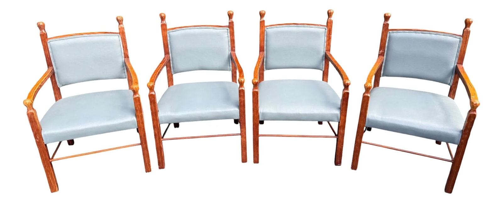 Late 20th Century Rustic Style Carved Wood and Blue Faux Leather Dining Chairs - a Set of 4: Quick Hits: Late 20th century carved wood dining chairs - set of 4 Rustic style with blue faux leather upholstery Heavily carved oak-like frames with subtle Western flair Comfortable curved backrest a