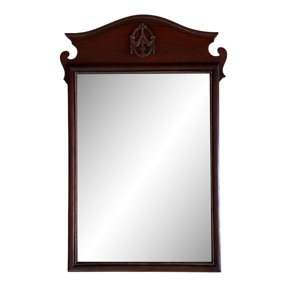 1940s Neoclassical Chippendale Mahogany Wall Mirror: Traditional Colonial Revival or Chippendale-inspired (popular in American furniture from the 1920s-1960s), with strong neoclassical touches. The serpentine arched crest with outward-scrolling volutes