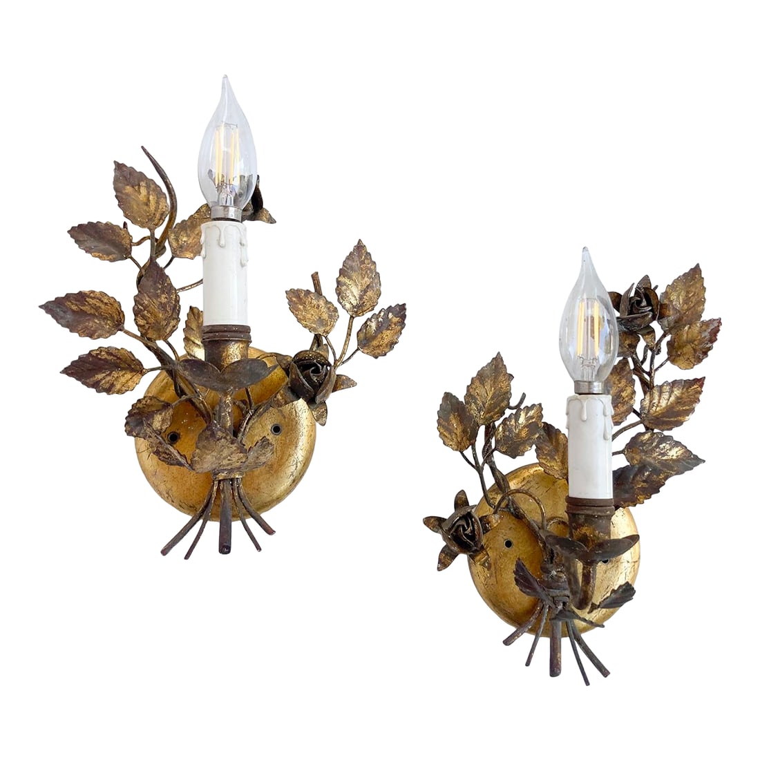 Vintage Florentine Gold Gilt Metal Rose Sconces - a Pair: This pair of Vintage Italian Hollywood Regency-style wall sconces features a Florentine gilt gold tole design with metal roses and leaves. These ornate candle-style wall lamps, often attributed to