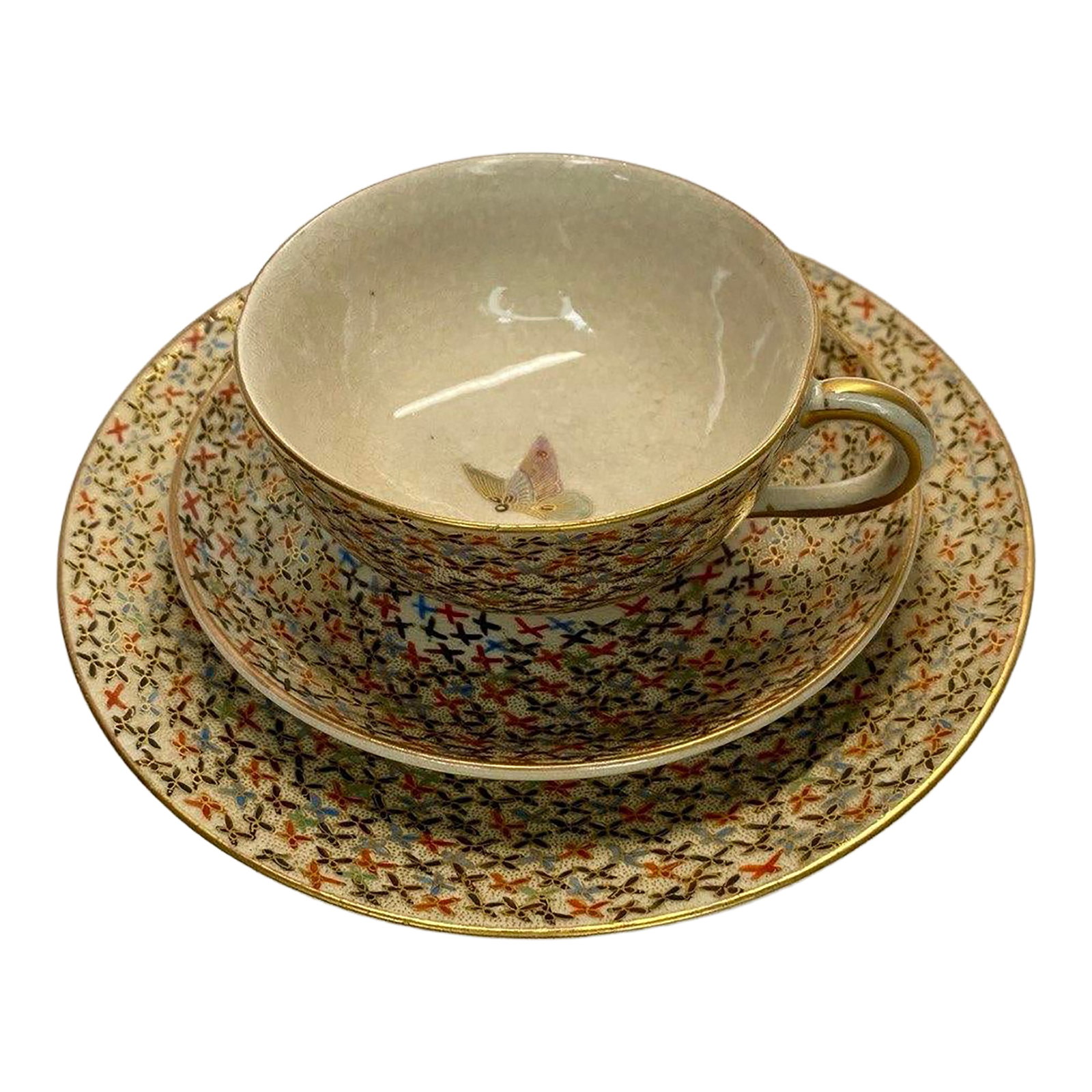 Antique Japanese Satsuma Butterfly Tea Cup, Saucer & Plate - Set of 3: An elegant and finely detailed Japanese Satsuma tea set comprising a teacup, matching saucer, and dessert plate, all decorated in a richly patterned millefiori-style ground accented with hand-applied